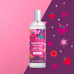 Bottle of Sugarplum Passion body mist with colorful label on pink and purple background