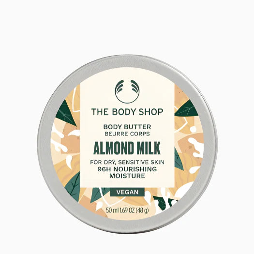 The Body Shop's Almond Milk body butter on a white background