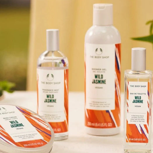 Collection of The Body Shop Wild Jasmine products on a neutral background